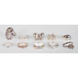 A collection of silver rings including 925 silver ring with butterfly design, a .925 silver with