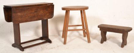 A vintage early 20th Century oak milk stool of rounded rectangular form raised on thick X frame