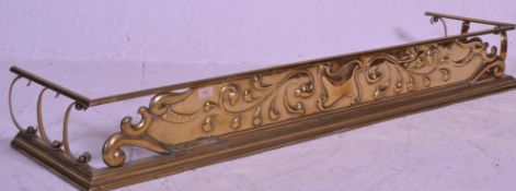 A good Victorian 19th century Arts & Crafts brass fire fender kerb being decorated into relief