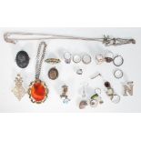 A collection of vintage and antique jewellery to include a carved black stone cameo brooch, a