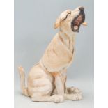 A Country Artists 'A Breed Apart' series figure of a dog 'Biscuit' shown seated. Model No 03451.