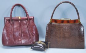 A group of three vintage handbags to include a red leather crocodile handbag, a brown crocodile skin