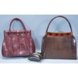 A group of three vintage handbags to include a red leather crocodile handbag, a brown crocodile skin