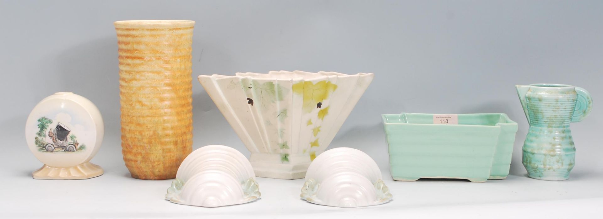 A small group of early 20th Century Art Deco ceramics to include a mint green table vase, a small