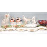 A mixed group of ceramic wares dating from the 19th Century to include a decorative ribbon plate