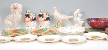 A mixed group of ceramic wares dating from the 19th Century to include a decorative ribbon plate