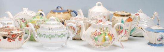 A mixed collection of various ceramic teapots dating from the 19th Century to include a luster