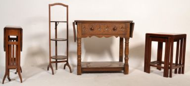 A Jaycee oak drop leaf occasional table with lower tray and drop leaf table top. Together with an