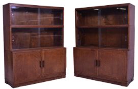 A good pair of mid 20th Century retro oak lawyers stacking bookcases by Minty of Oxford. Each having