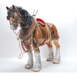 A large vintage 20th Century ceramic figure ornament of a shire horse in the manor of Beswick having