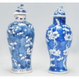 Two Chinese vases of baluster form each hand painted in the prunus pattern, both having flared rim