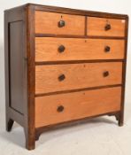 An early 20th Century  two tone colourway oak chest of drawers having two short over three long