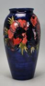 Walter Moorcroft - A vintage mid 20th Century Moorcroft vase of tapering form in the Anemone pattern