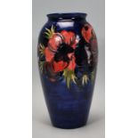 Walter Moorcroft - A vintage mid 20th Century Moorcroft vase of tapering form in the Anemone pattern