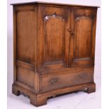A good quality oak Tv / Cocktail cabinet in the manner of Rackstraw. Raised on block feet with short