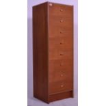 A vintage mid 20th Century teak wood tall chest of drawers having a bank of eight graduating
