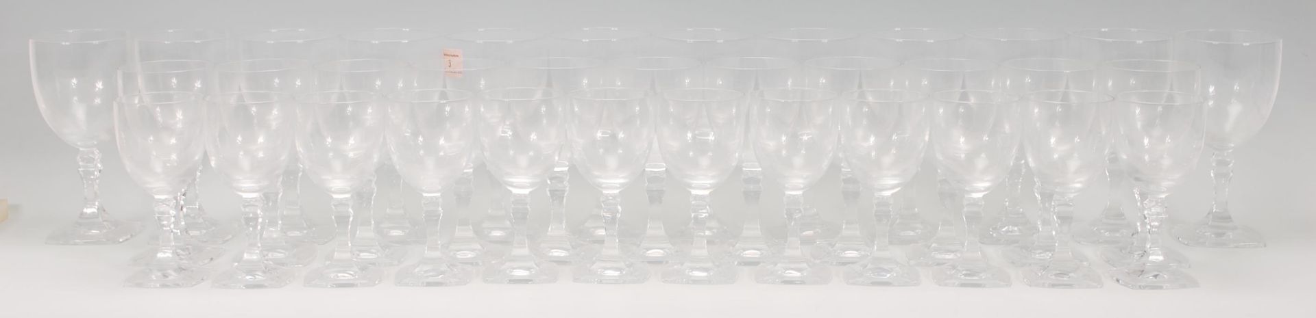 A collection of vintage 20th Century crystal glasses, the set to include 12 red wine glasses, 11