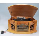 A contemporary antique style hi-fi stereo system in oak wooden effect, The system comprising tape