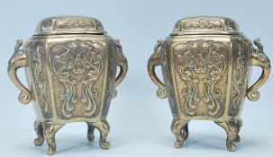 A pair of 20th Century Chinese bronze incense burners of rectangular form having chamfered edges,