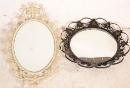 Two 20th Century wall mirrors to include a concave round mirror with scrolled iron work frame having