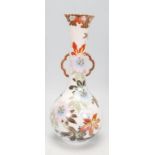 A Japanese stem vase having a bulbous form body with a cylindrical neck having two shaped twin