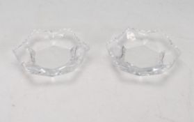 A pair of Lalique glass night light / tea light holders of hexagonal form having faceted sides and