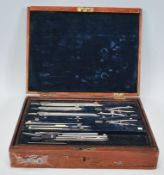 A vintage 1920's / 30's mahogany cased draughtsman / engineers drawing tool set having a blue velvet