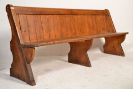 A Victorian 19th century Gothic Arts & Crafts solid oak pew bench of ecclesiastical form being