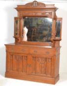 A late Victorian oak Arts and Crafts mirror backed