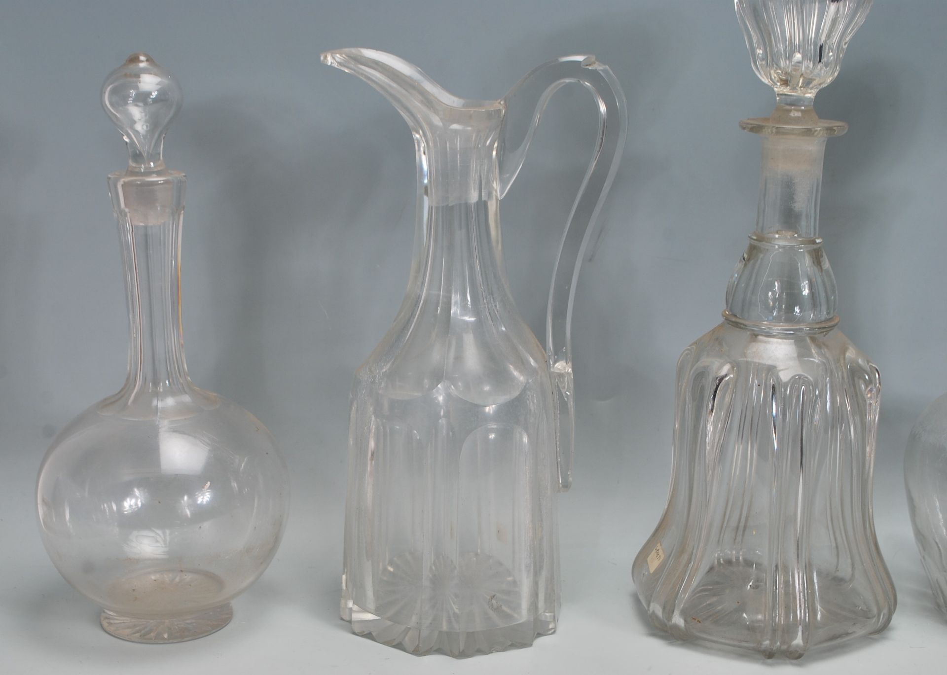 A good collection of mixed decanters dating from the 19th Century Georgian era to include a bell - Image 5 of 7