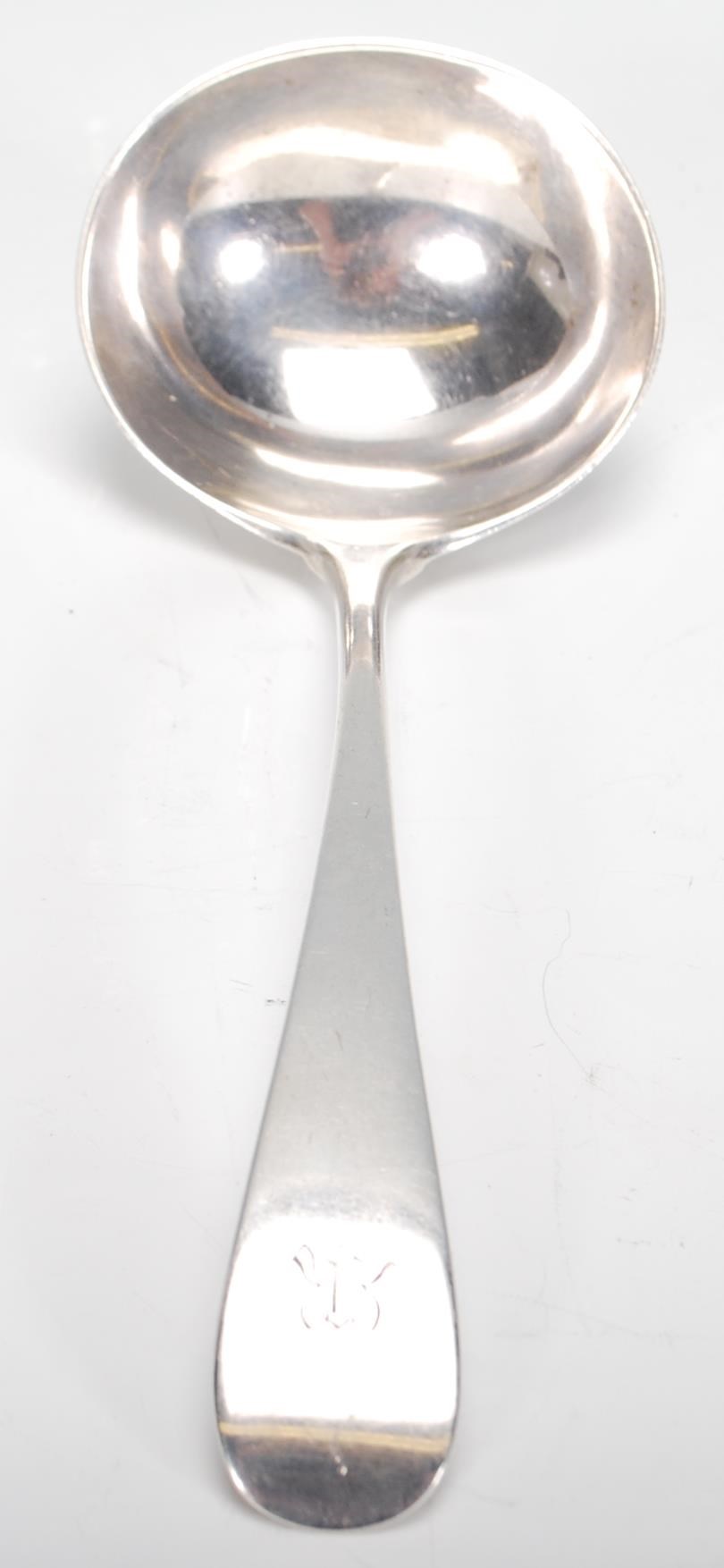 A silver hallmarked serving ladle spoon of usual form, London assay with makers mark for Reid & Sons - Image 5 of 6