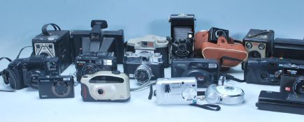 A large collection of 20th century vintage 35mm photography cameras to include: Halina 35X Super,