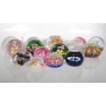 A large collection of 20th century paper weights, to include multi colour floral examples, control