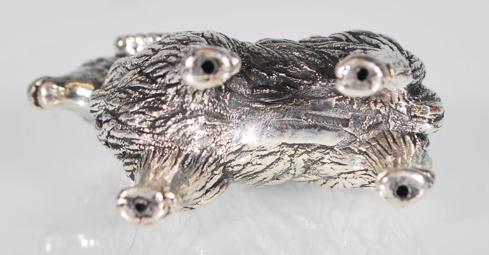 A small sterling silver pin cushion in the form of a ram. Measures: 3.4 x 4.3 x 1.2. Weight: 14.6g. - Image 7 of 7