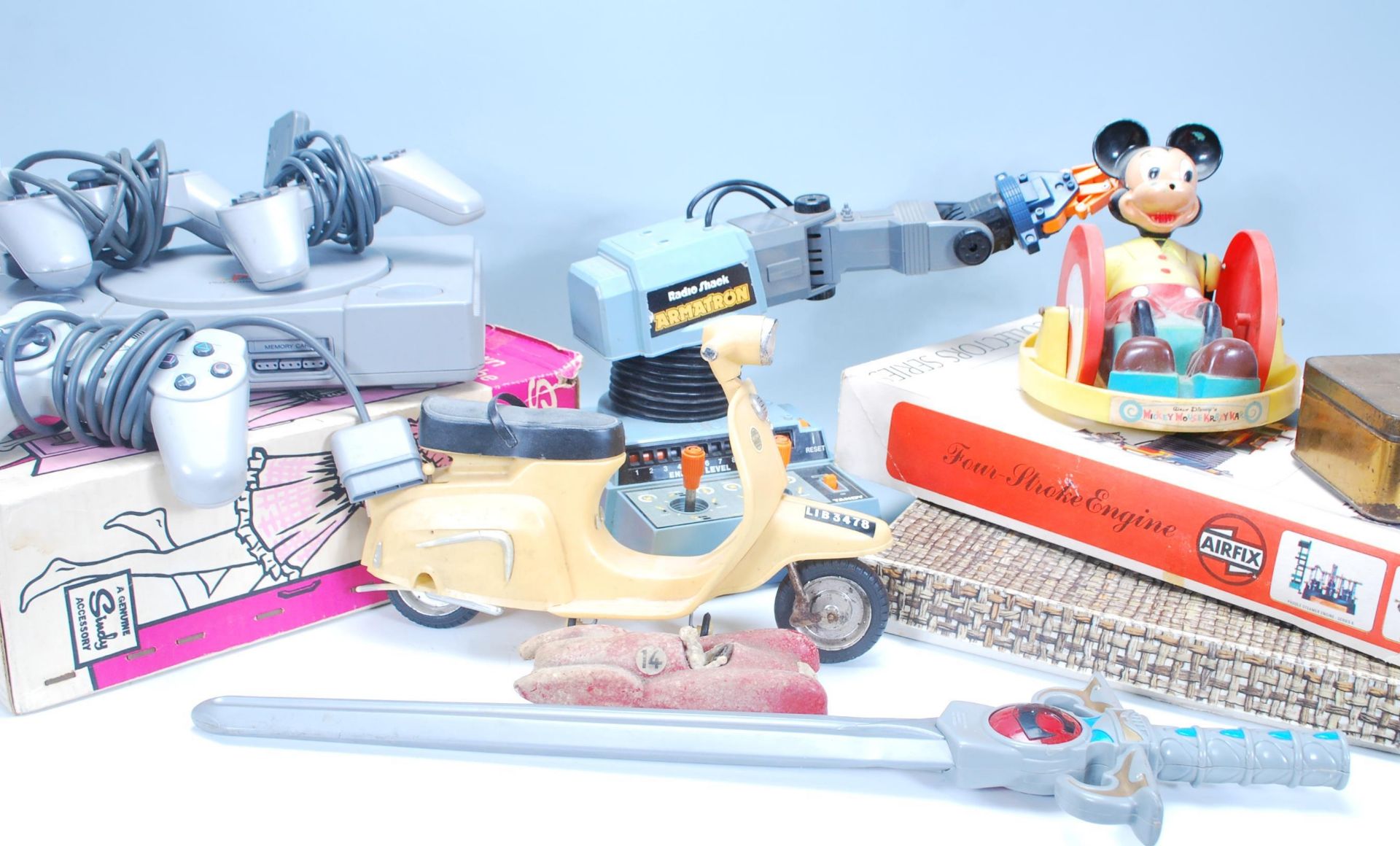 A mixed collection of vintage toys / video games to include Sindy's Wardrobe, Playstation 1 and