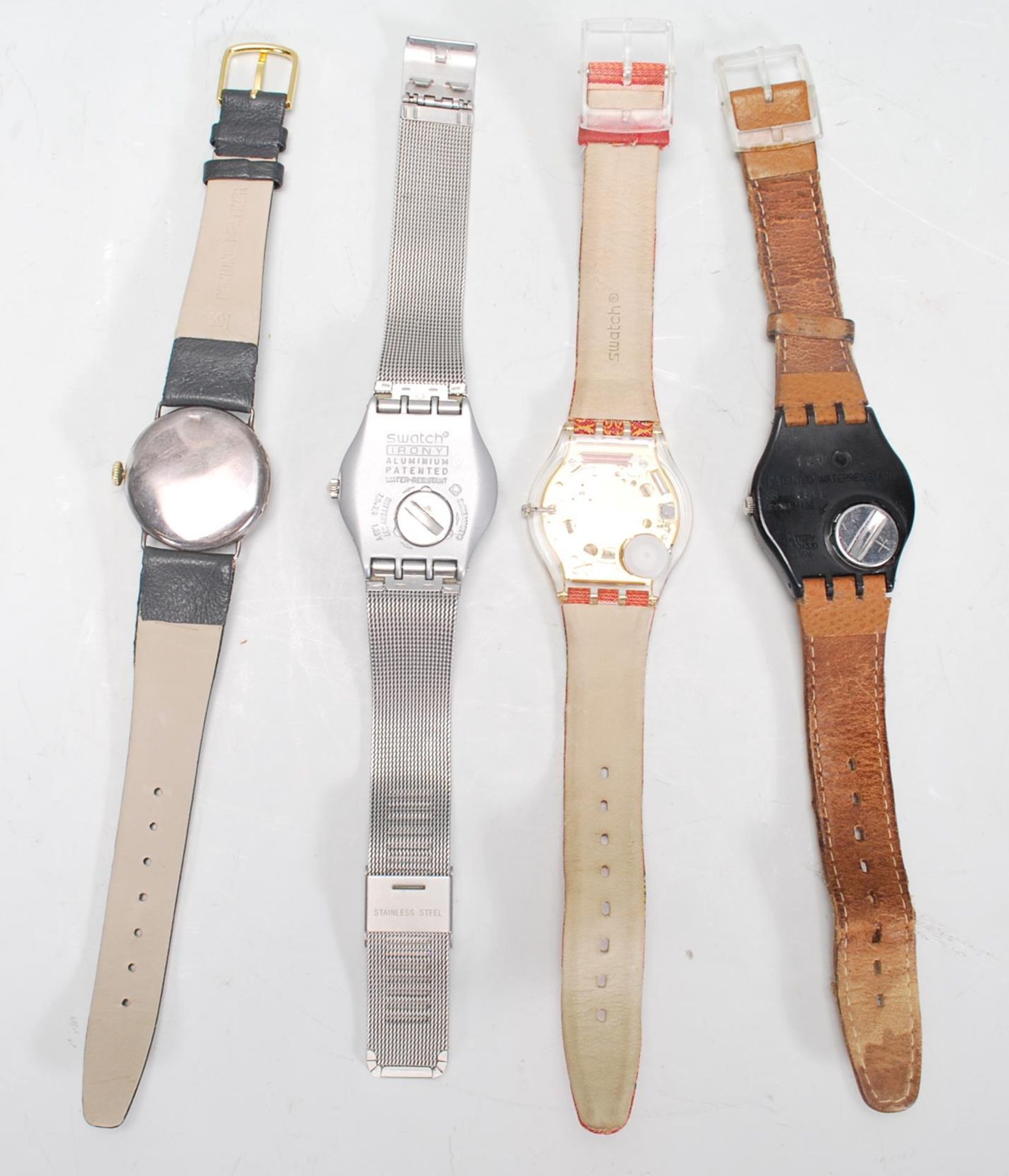 A group of three Swatch watches to include a silver tone bracelet watch, a brown leather strapped - Bild 4 aus 4