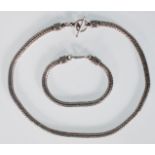 A gentleman's silver large snake chain necklace having a toggle clasp together with a matching