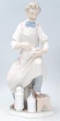 A Lladro porcelain figure of the 'Pharmacist' shown seated with a pestle and mortar. Marks to base