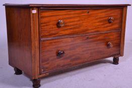 A Victorian 19th century mahogany end of bed chest of drawers. Raised on turned legs with short