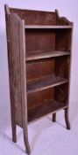 A 20th century rustic campaign style oak folding bookcase shelf. The carved gallery detailed top