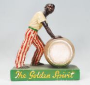 A vintage mid 20th Century Lemon Hart Rum advertising countertop figurine in the form of a figure