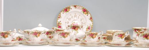 An extensive Royal Albert Old Country Roses china dinner and tea service having red rose