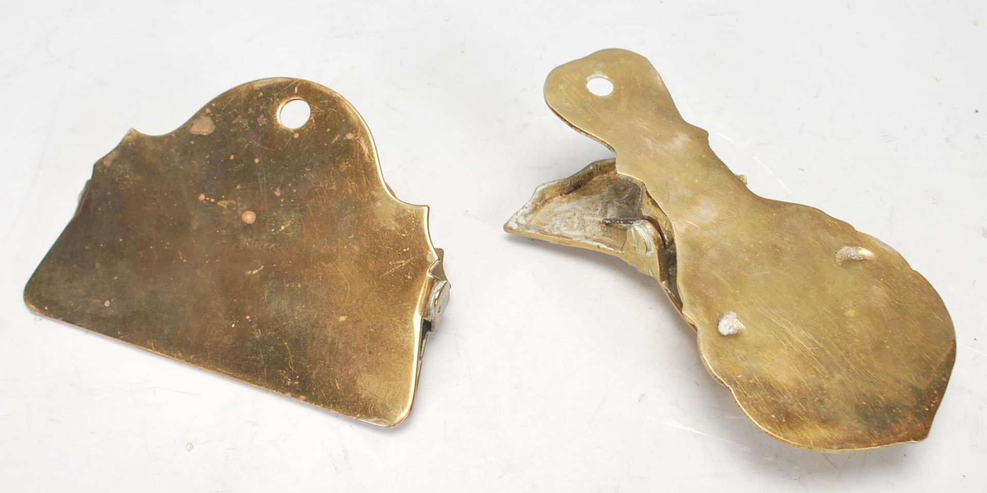 A pair of antique brass wall mounting paper clips to include one in the form of a hand with a - Image 4 of 4