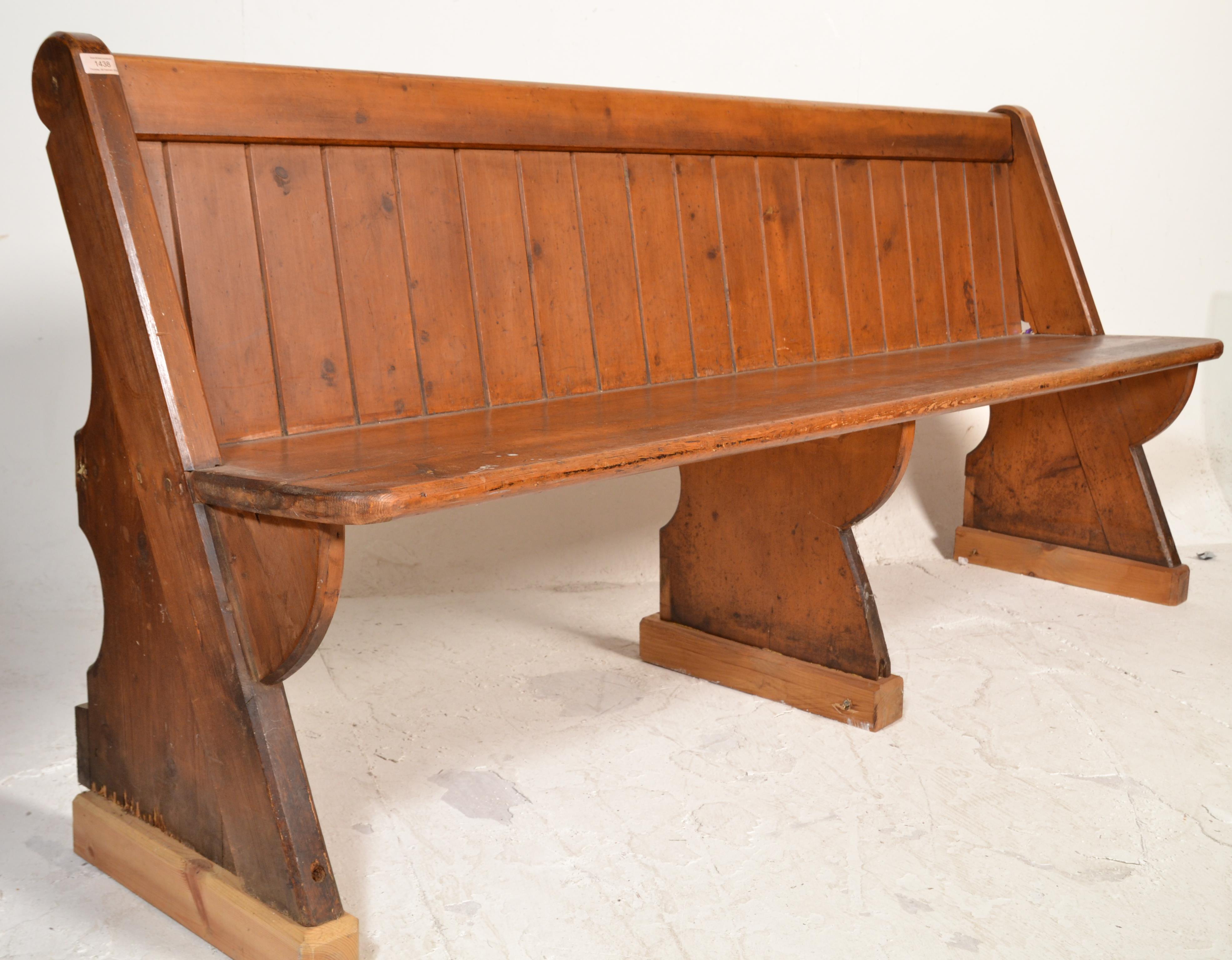 A Victorian 19th century Gothic Arts & Crafts solid oak pew bench of ecclesiastical form being