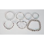 A collection of silver bracelets including a 925 silver chain bracelet, a 925 silver bracelet of