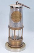 A mid 20th Century brass Eccles miners lamp embossed brass plaque reading 'Protector Lamp & Lighting