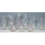 A good collection of mixed decanters dating from the 19th Century Georgian era to include a bell
