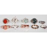 A collection of Silver rings including a .925 silver ring inset with an iridescent feature stone,