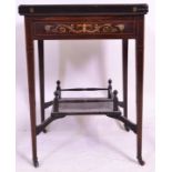 An Edwardian rosewood and marquetry envelope card table in the manner of Edwards & Roberts, the