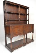 A Georgian revival oak cottage dresser, the open d